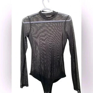 Source Unknown  black sheer bodysuit